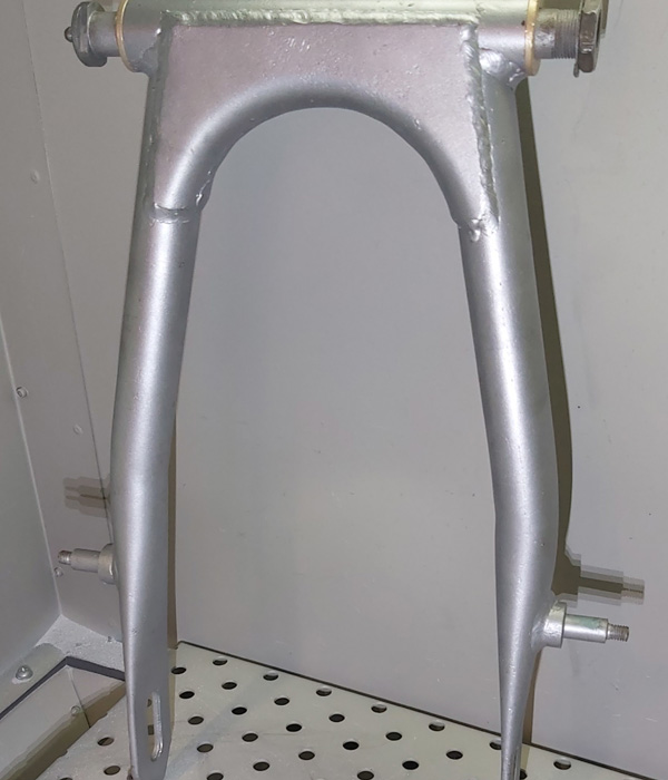 Vapour blasting would actually dull down this finish